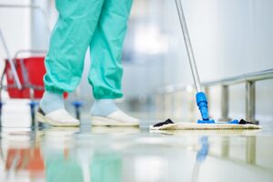 hospital cleaner wiping floor